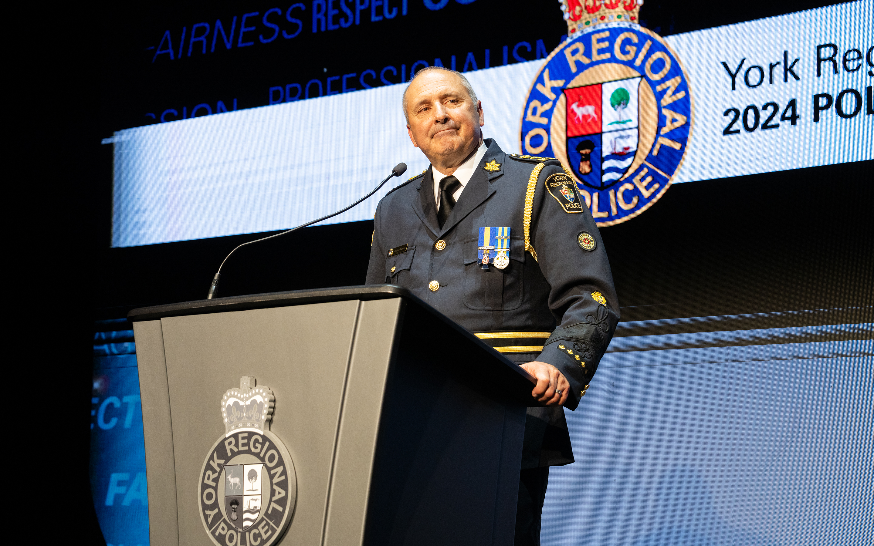 YRP Chief Jim MacSween stands at a podium