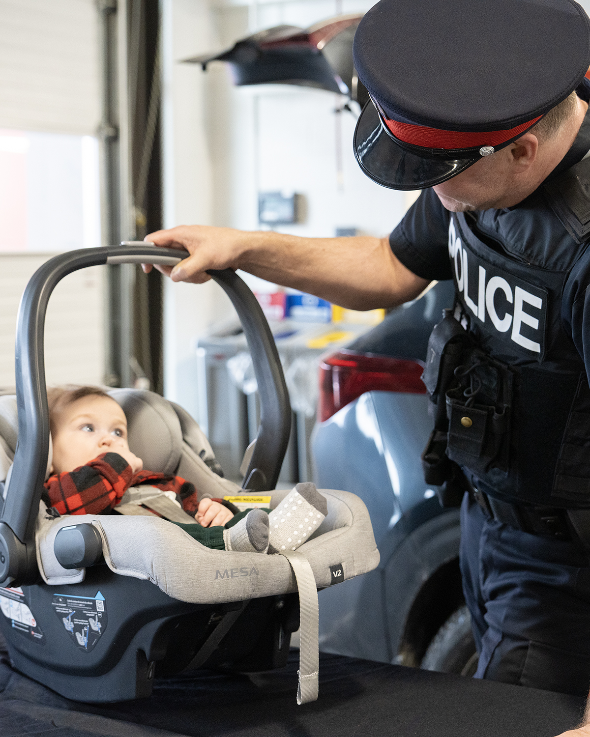 Officer assesses toddler in car seat