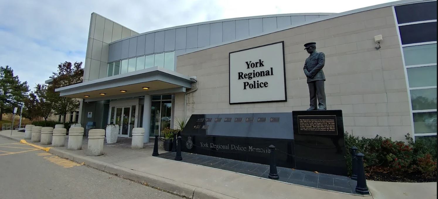 2 District A yellow brick building with large logo